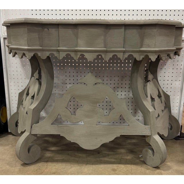 Boho Chic Painted Decorator Console Table featuring intricate carved details, distressed finish, and vibrant, eclectic...