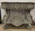 Boho Chic Painted Decorator Console Table featuring intricate carved details, distressed finish, and vibrant, eclectic...