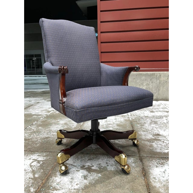 American legislative chair featuring antique style carved claw arm five prong carved mahogany base lacquered brass shoes,...