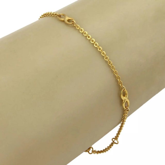 Material: 21k yellow gold Measurement: 10" long x 0.13" wide Weight: 3.2 grams This lovely chain anklet is crafted from...