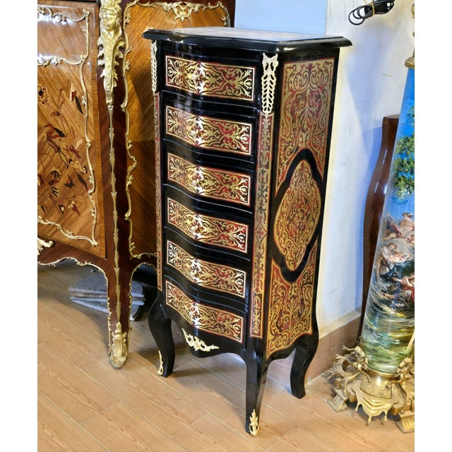 Bring timeless French elegance into your home with this exquisite Boulle-inspired lingerie chest, masterfully handcrafted...