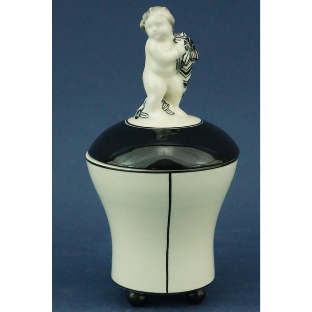 Item : beautiful vase or small box with a glazed ceramic lid, entirely decorated in black and white art deco style, with a...