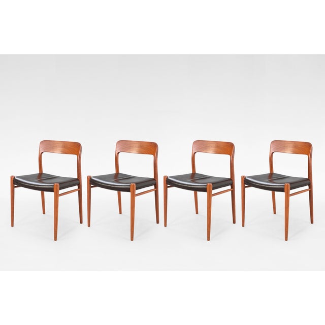 This set of four Model 75 dining chairs by Niels Otto Møller, produced by J.L. Møller Møbelfabrik in Denmark during the...