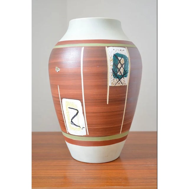 German mid-century ceramic vase from the Bay company. - Ceramic vase with surrounding decoration - Remnants of the...