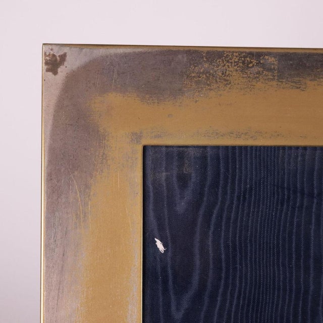 Silver plated brass photo frame. Designer's signature engraved. This piece is attributed to the mentioned designer/maker....