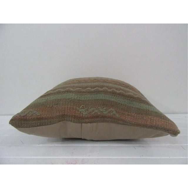 This is a pillow cover made from a vintage kilim rug. The piece was properly washed and ready to use.