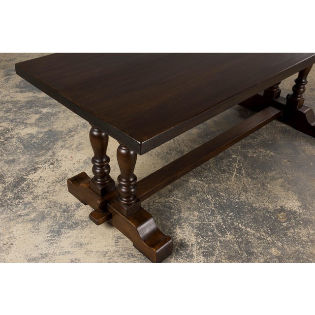 An early 20th-century French country farmhouse trestle dining table, sourced in Provence. Expertly handcrafted from solid...