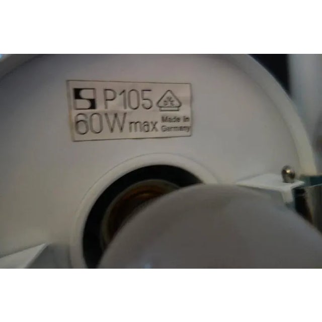 This cascading pendant was produced by Staff Leuchten in Germany during the 1970s. The light features five pendants with...