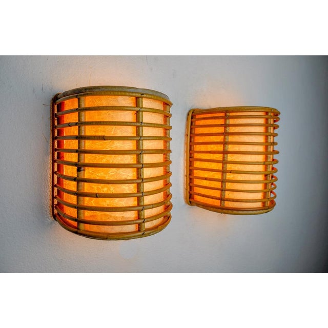 Very nice pair of rattan sconces designed and produced in France in the 1960s. A design classic that will perfectly...