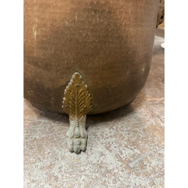 Vintage lions head, paw footed brass hammered jardiniere, can be used as a log holder, fireplace accessory.