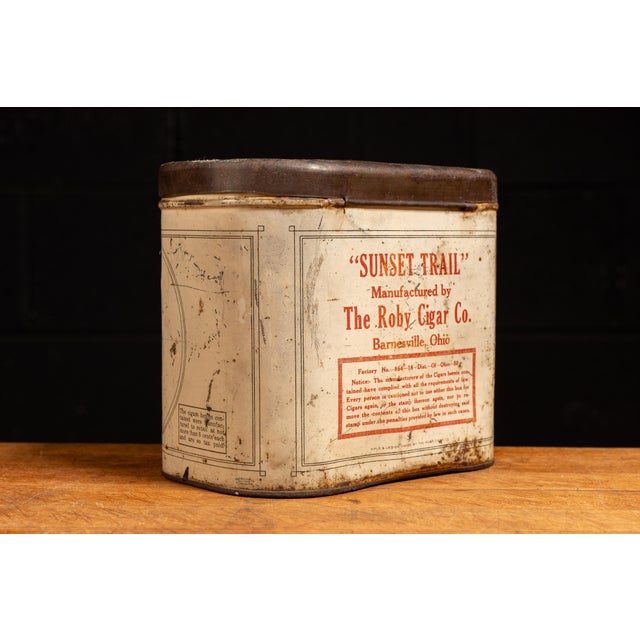 Mid-20th-century Sunset Trail cigar advertising tin manufactured by Federal Tin Co., Inc. for The Roby Cigar Co. of...