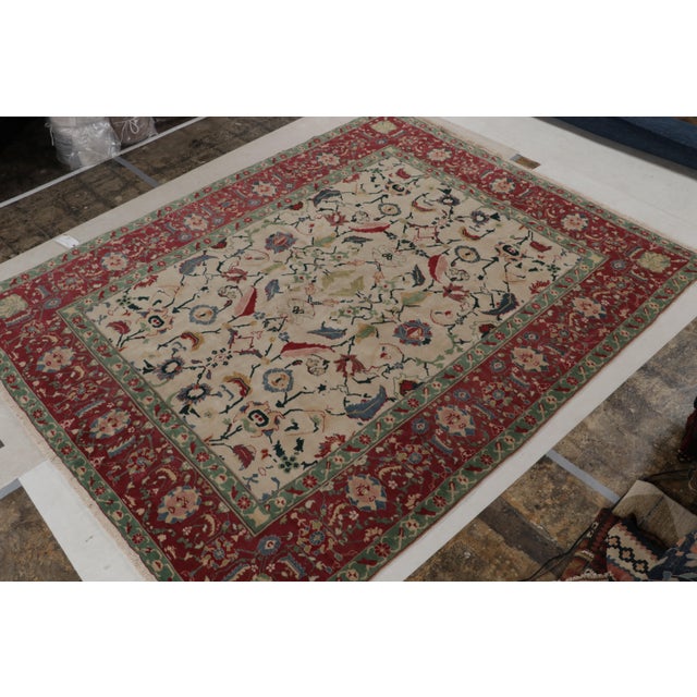 This 9x11 rug is an ode to antique Agra rugs, and a new addition to Rug & Kilim’s Modern Classics Collection. It’s...