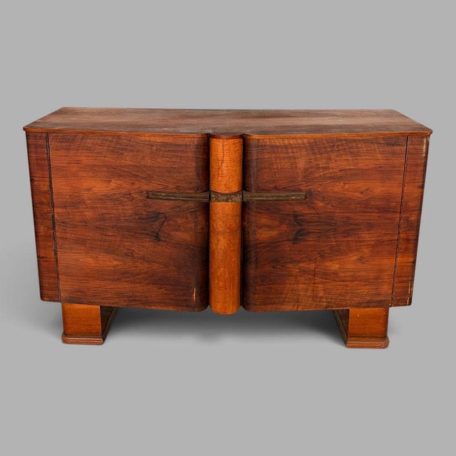A striking Art Deco walnut sideboard by Talent , dating from the 1930s and featuring beautifully figured walnut veneers,...