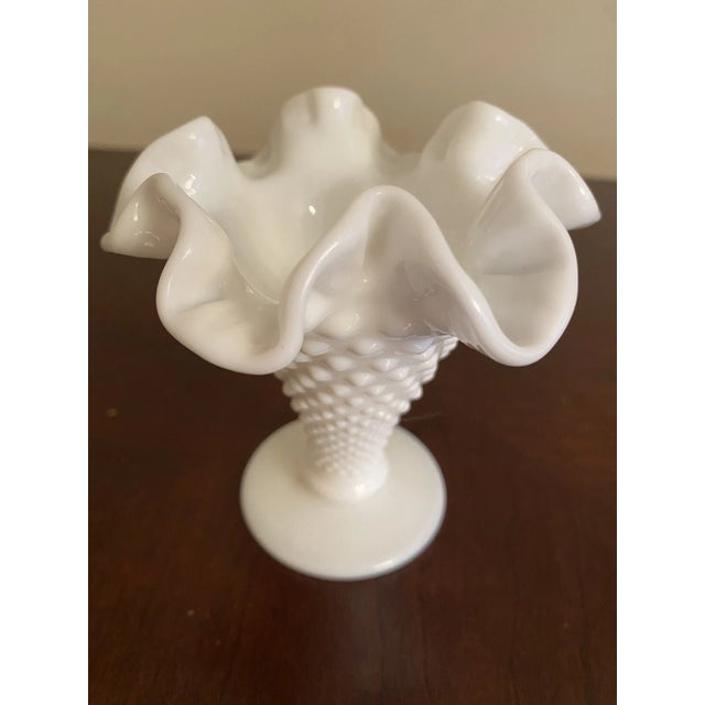 Add timeless Mid-Century charm to your home with this beautiful Vintage Fenton White Milk Glass Hobnail Vase. Featuring...