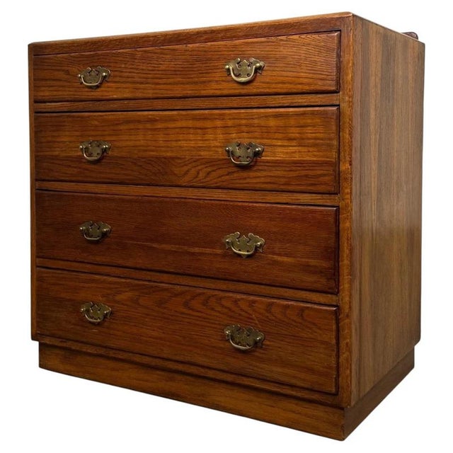 A handsome and highly practical 20th-century golden oak chest of drawers, combining generous storage capacity, traditional...