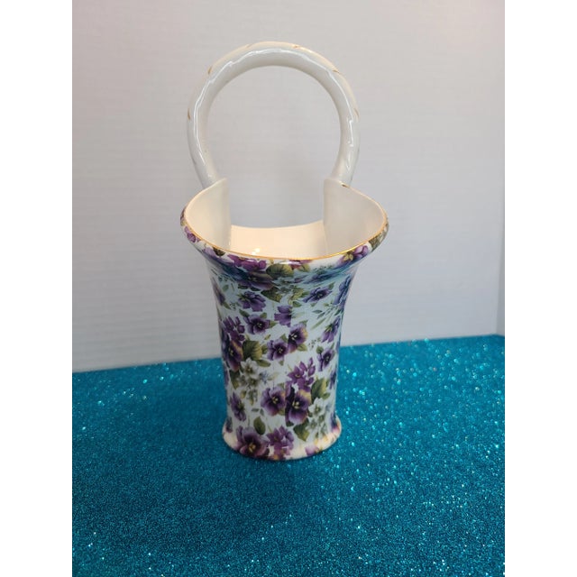 Vintage purple pansy chintz Formalities basket by Baum Bros, depicting purple flowers and leaves on a white background,...