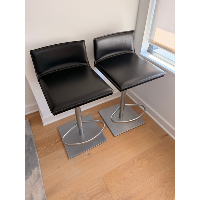 Bottega Piston Stool (2003) swivels 360 degrees and instantly adjusts between counter height and bar height – and anything...