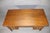 Mid-Century Modern desk made by the Indiana Desk Company. Large walnut desktop and five drawers with brass handles.