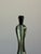 A mid century glass table lamp attributed to Fontana Arte. Comprised of graphic glass pieces and brass hardware. Sourced...
