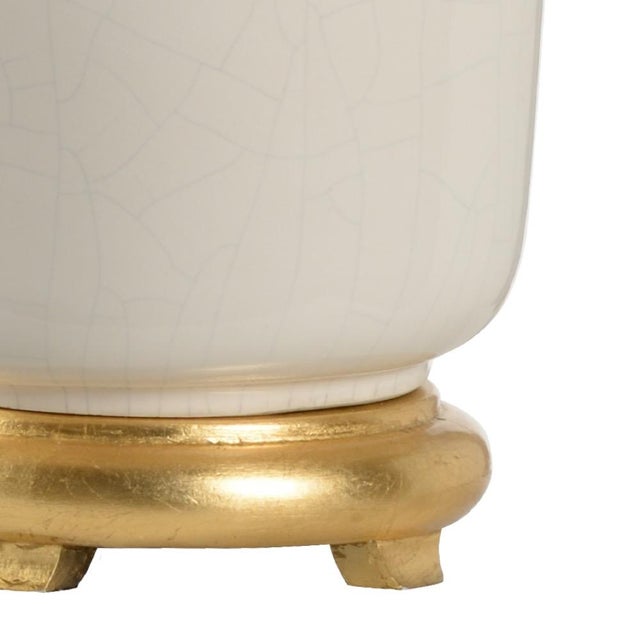 Refresh your home with our olsen lamp. This transitional design features a snow white glazed ceramic vase with a classic...