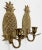 Vintage detailed brass wall sconces with the welcome pineapple motif. Each holds a single taper candlestick. Holes for...