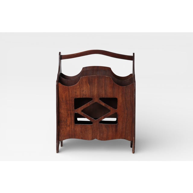 Vintage wooden magazine rack in a classic Chippendale-style design, featuring three compartments for magazines or records,...