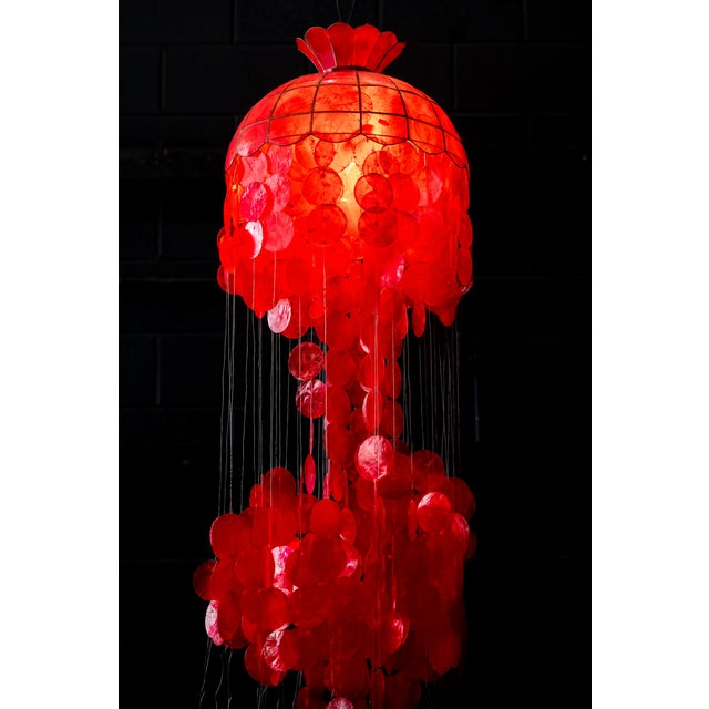 Vintage red three-tier capiz shell hanging chandelier in good, working condition. Total Height: ~60" with chain