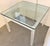 Good quality and rare square table from 80's. Base is made of frosted lucite with four clear lucite spheres. Glass top has...