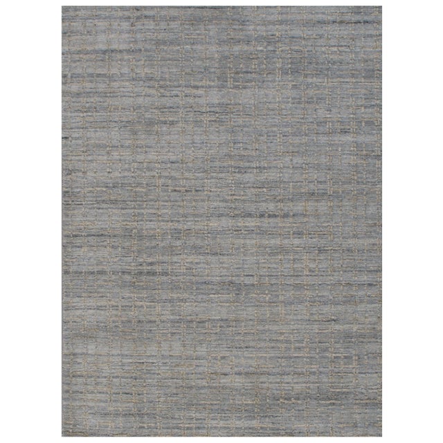 Crafted from a blend of wool and viscose, this contemporary rug boasts a luxurious firm mid-height pile, offering both...