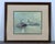 Lithograph by maritime artist John Kelly, presented in a wood frame with a silk mat under glass. The work reflects Kelly’s...