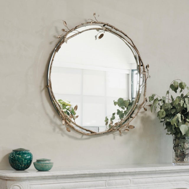 Nestled within the embrace of meticulously crafted branches, the Lennox Mirror weaves one of a kind metal artistry into...