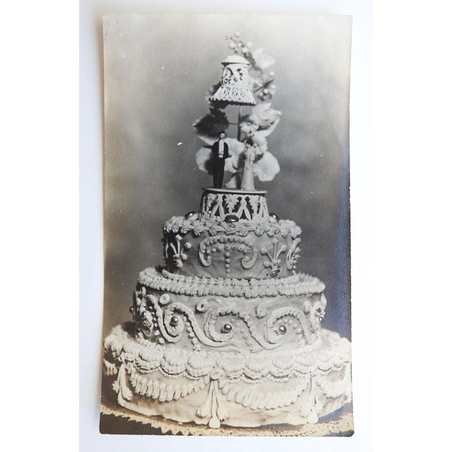 Early 20th century silver gelatin snapshot photograph of an elaborate wedding cake. Unsigned. Unframed.
