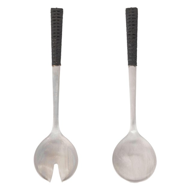Elevate your dinner parties with the Rattan Stainless Steel Serving Pieces (Set of 2). This stunning set includes a...