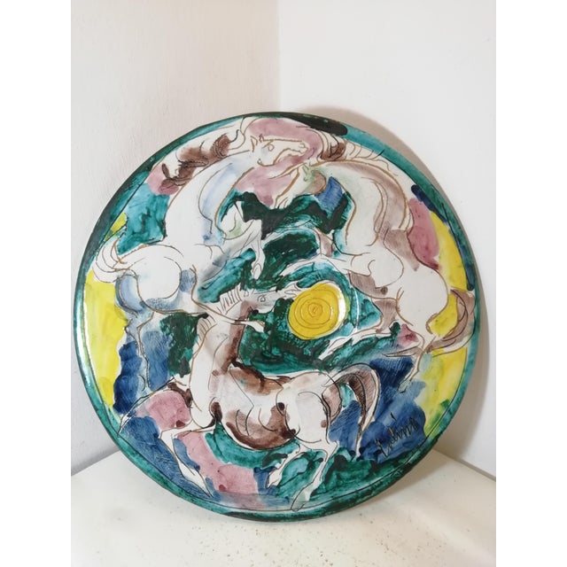 A beautiful display plate crafted by Maestro Eliseo Salino. This one features a typical melee of horses, typical of...