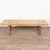 The appeal of this rustic coffee table comes from the thick wood top that originally served as a worktable, all resting...
