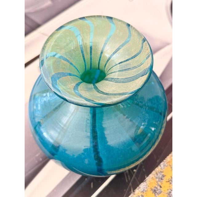 A beautiful glass vase in tones of green and blue designed by Michael Harris for Mdina, Malta. Measures: approx. 5.5" x 5"...