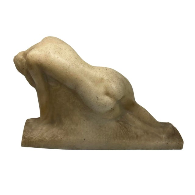 The Awakening" by Vincent Glinsky is a striking and dynamic sculpture that depicts a figure emerging from the earth or...