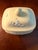 The Wedgwood Yellow Primrose Rectangular Lidded Box with White Relief Prunus Blossoms is a decorative pottery trinket box...