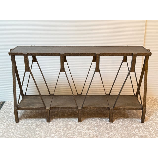 Design Plus Gallery presents the Scissor Console Table from CB2. The console is made from hand-hammered iron angles in a...