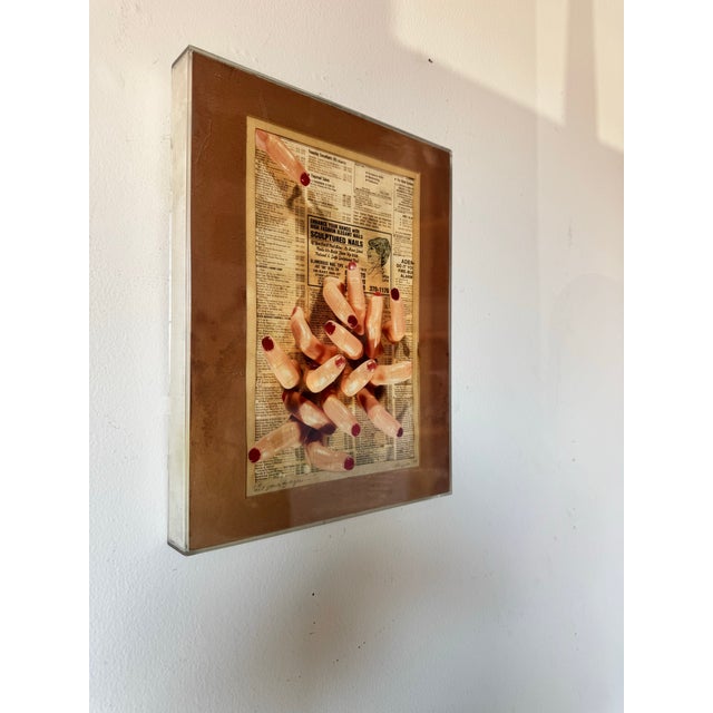 Striking and surreal, this 1987 mixed-media collage wall art painting by Polizzotto titled “Let Your Fingers” presents an...