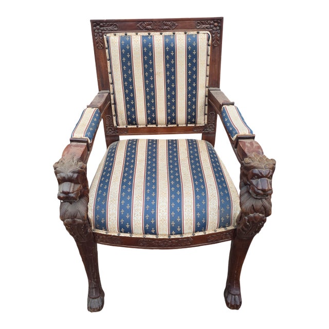 Early 20th Century Victorian Carved Armchair with Lion Head Arms and Claw Feet For Sale