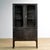 Vintage medicine cabinet from the 1970s, produced in Hungary. The cabinet is made of iron and glass, with the glass held...