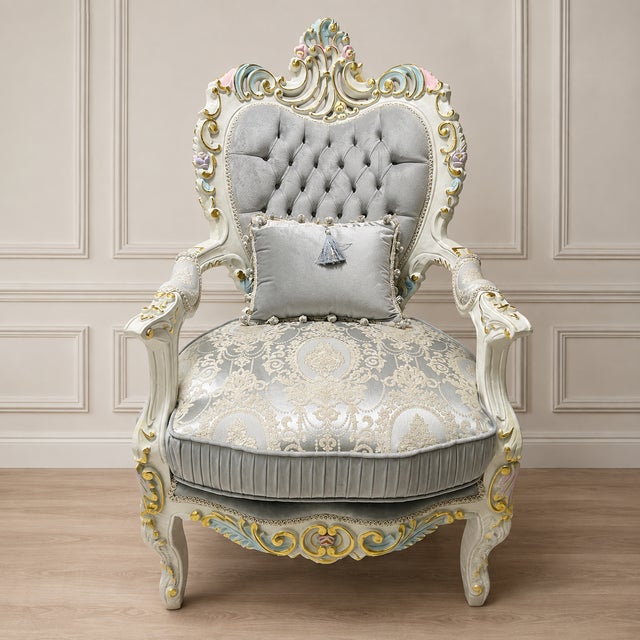 Bring a refined French château aesthetic into your space with this ornate Louis XV-inspired armchair. The chair features...