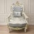 Bring a refined French château aesthetic into your space with this ornate Louis XV-inspired armchair. The chair features...