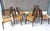 Beautiful and elegant dining chairs made from teak and with their original untouched cord seats. These have been used with...
