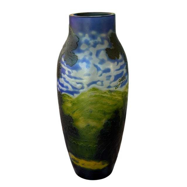 This is a Contemporary Vase in the style of Emile Galle. It features a beautiful blue, green, and brown pallet. It...