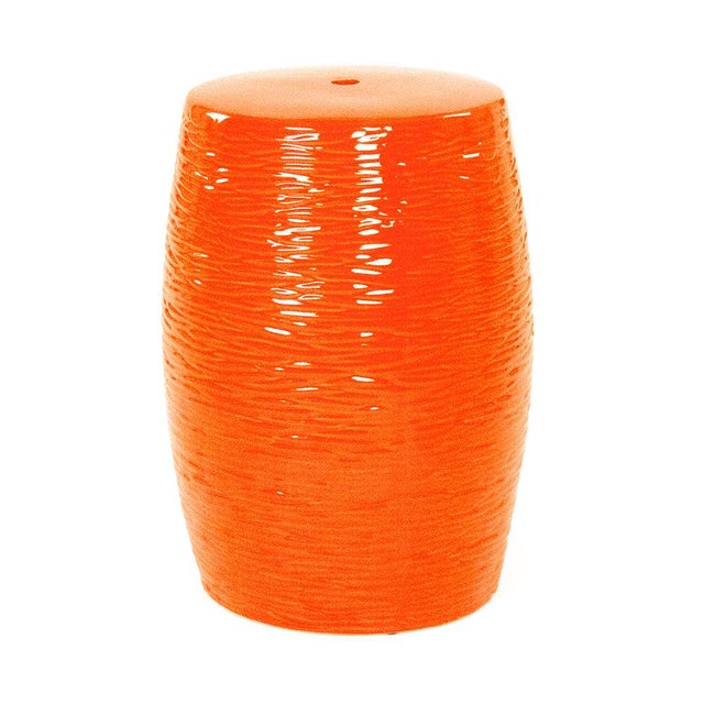 The Sinclair Garden Stool is a ceramic garden stool with a classic barrel form and an allover textured ripple pattern in a...