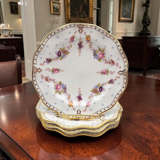 A delicate study in refinement, this Royal Crown Derby bread plate embodies the lightness and grace of English bone china....