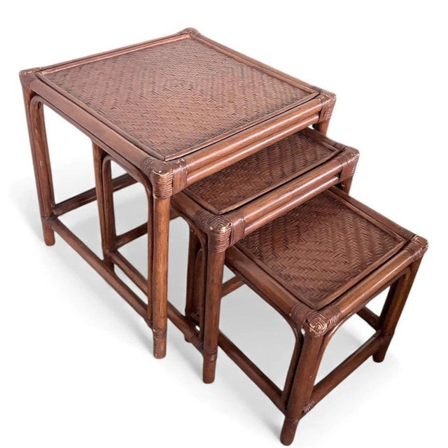 This set of vintage nesting tables offers a stylish and functional solution for adding natural charm to your living space....