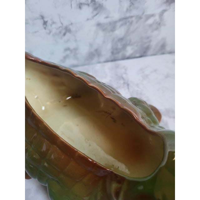 This toothy little alligator planter from the 1960s would look stunning with a succulent or could be used as an accent...